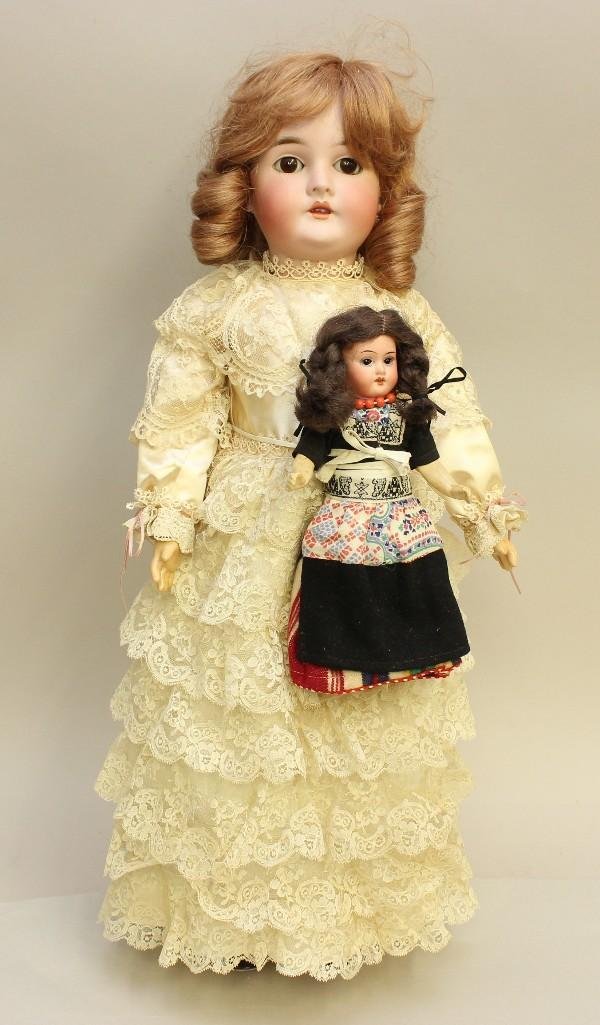 PAIR OF ANTIQUE GERMAN BISQUE HEAD DOLLS. (1 of 4)