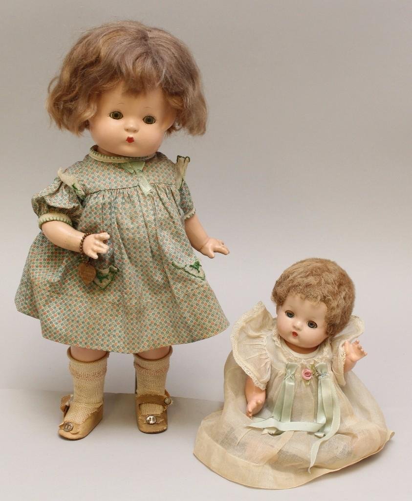 PAIR OF EFFANBEE PATSY FAMILY COMPOSIITON DOLLS:: 9" Babyette - blue sleep eyes, brown skin wig. Dressed in replaced clothing of the period (that is a little large on doll). Condition: light crazing. 14" Patsy - green sleep eyes, brown moha