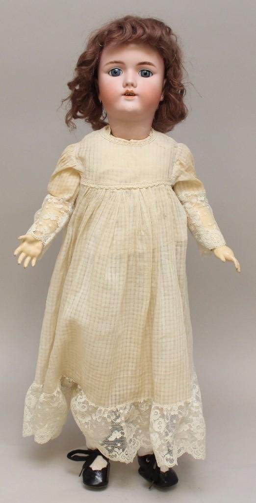 24" 109/12 N DEP GERMANY HANDWERCK 4 1/4 ANTIQUE BISQUE: Stationary blue eyes, open mouth, brown mohair wig, pierced ears. Papier mache ball jointed body. Dressed in antique white cotton dress and underwear. Newer shoes, socks. Condition: black kiln dust on