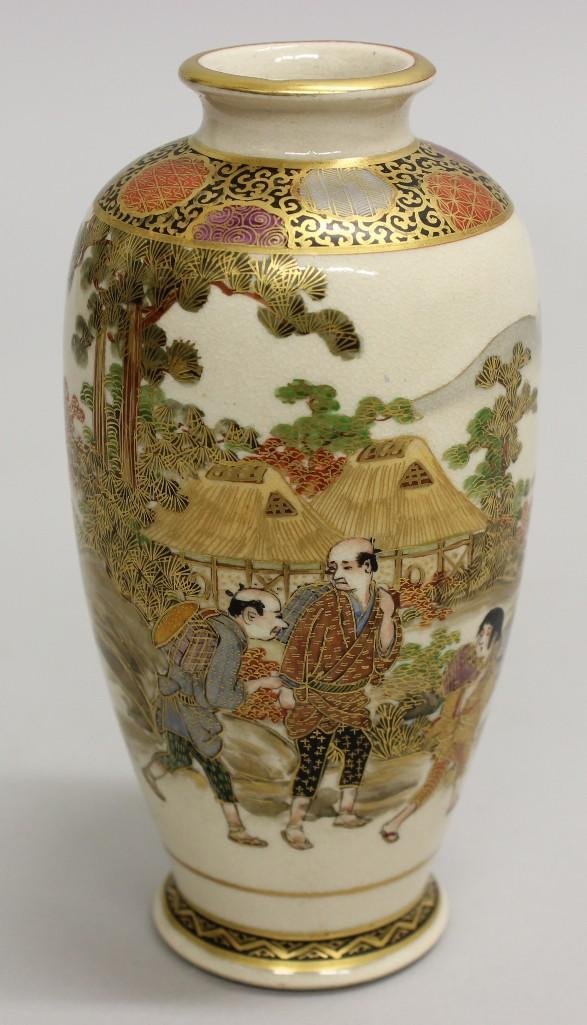 Satsuma Vase of Three Men: Vase painted with multiple colors and gold detail. Village scene and three men walking together. Marked on underside. 4.75"h x 2.5"w.