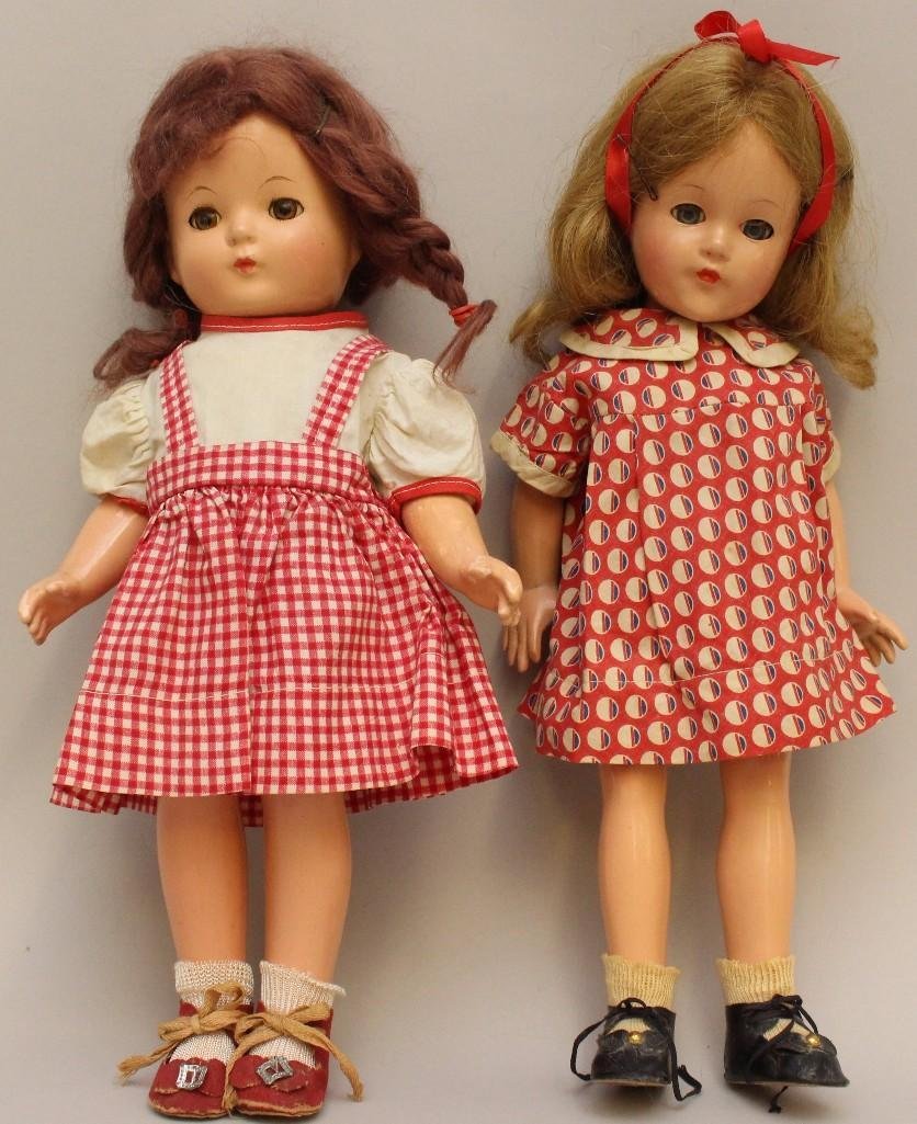 PAIR OF EFFANBEE COMPOSITION DOLLS: PATRICIA & ANNE: 15" "Patricia" with red mohair braided wig, brown sleep eyes. Doll has the brass heart necklace. Dressed in replaced vintage clothing, red oilcloth shoes, socks. (Is this Anne of Green