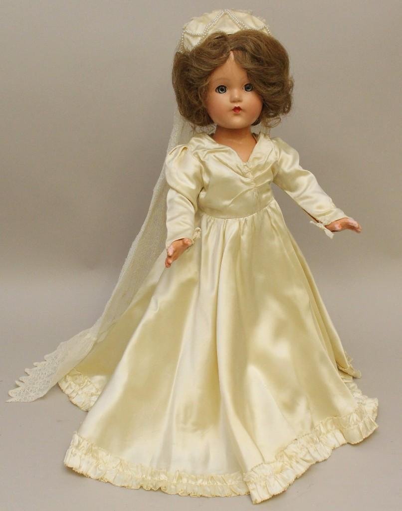 18" ALL ORIGINAL EFFANBEE COMPOSITION "LITTLE LADY": Blue sleep eyes, very dark honey blonde human hair wig. Doll has very high coloring. Original bridal gown, veil, sandals. Condition: light crazing. Paint flaking on fingers.