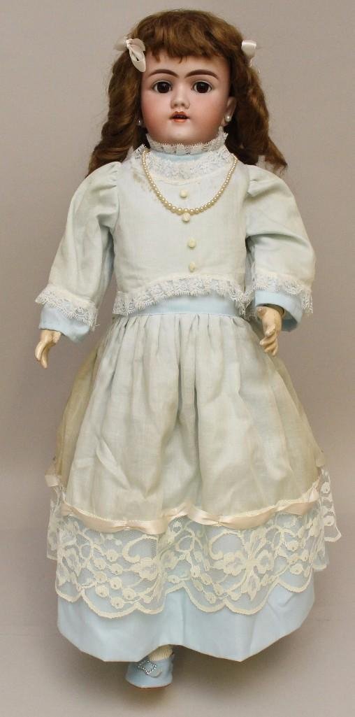 23" 109 -124 DEP. HANDWERCK 4 GERMANY ANTIQUE BISQUE: Brown sleep eyes, open mouth, pierced ears, brown mohair wig. Papier mache ball jointed body. Dressed in newer clothing, Pale blue leather sheos. Condition: back of head is cracked.