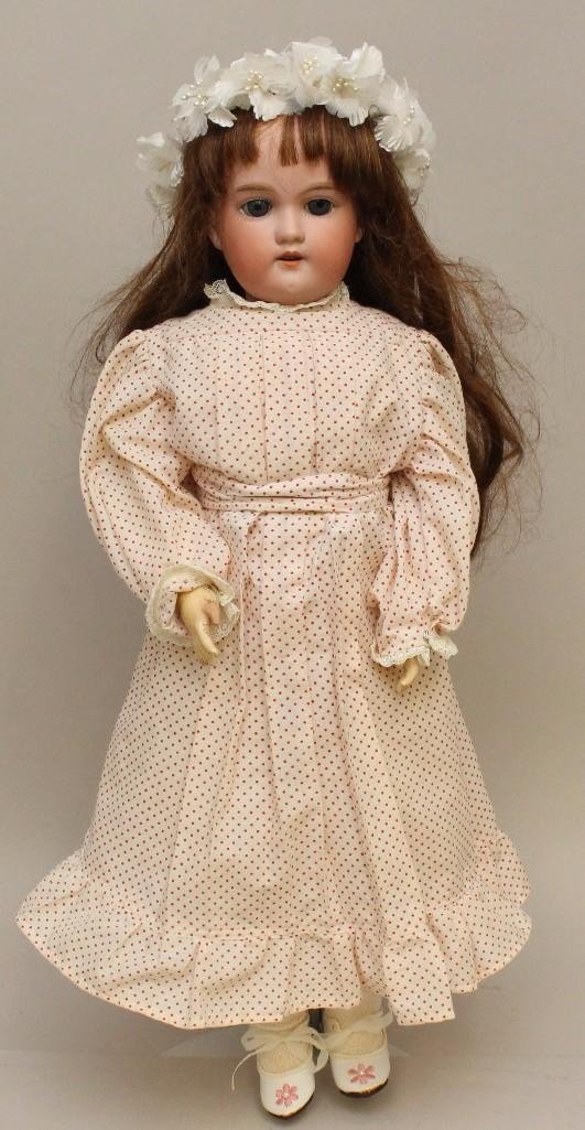 22" MADE IN GERMANY FLORADORA A.6.M. ANTIQUE BISQUE: Stationary blue eyes (that are on a rocker frame and could be reset properly to sleep). Open mouth, replaced wig. Papier mache ball jointed body. Dressed in newer clothing, shoes, socks. Condition: no
