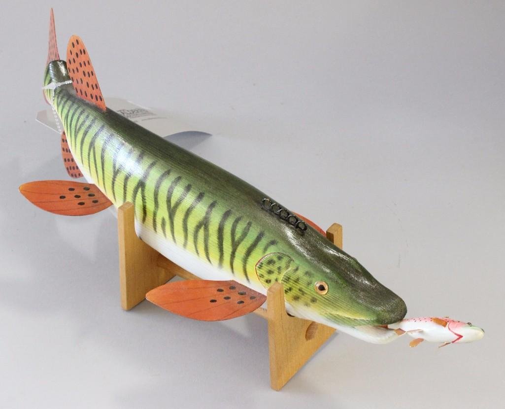 Wood Muskie w/ Rainbow trout in mouth - Rick Brooks: On wood stand, fish has metal fins, bottom fin signed by Rich Brooks, 13" long