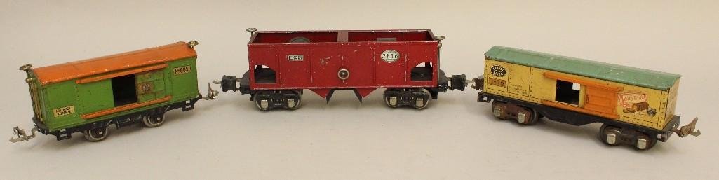 Lot of 3 Lionel Cars: Hopper car #2816, Baby Ruth candy box car #1679, green and orange box car #805.
