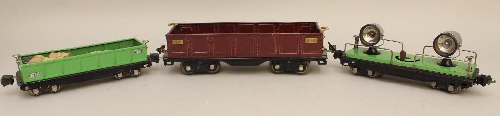 Lot of 3 Lionel Cars: Flat double search lights car in green, Gondola car #812 included barrels and box, Gondola style car #512.