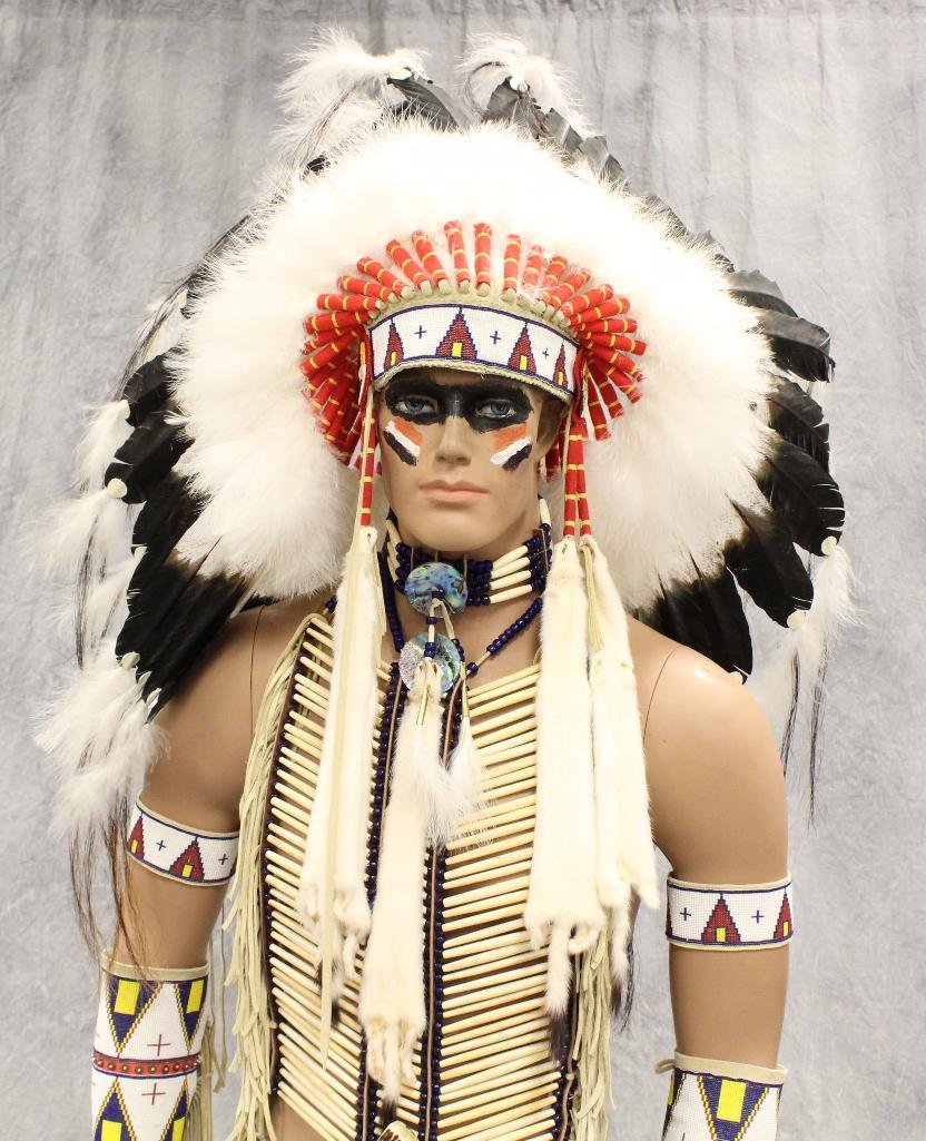 Indian War Chief Mannequin Dressed in Tecumseh's: Custom made head dress and beaded sheath by Tecumseh's Trading Post in WY. Includes head dressing, garments, bone handle knife, beaded sheath and moccasins. Approximately 6' 5&qu