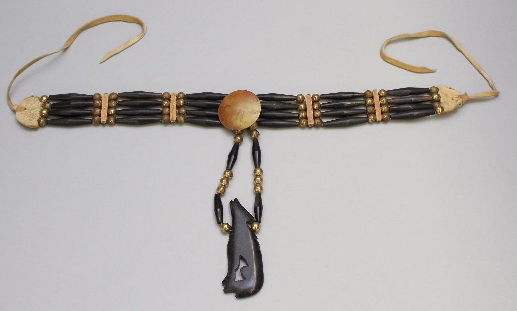 Native American Choker Necklace: Four strand black bone beads with wolf pendant. 33" long.