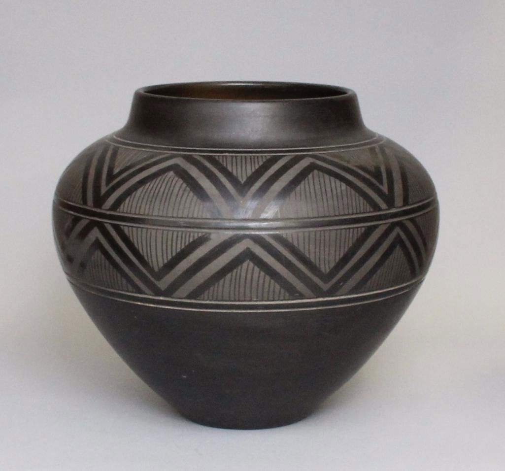 Native American San Ildefonso Pottery: Approximately 9" tall x 32" in diameter.