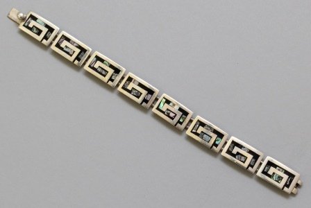 Native American Silver Bracelet: Abalone inlay. Marked \"TC-163,MEX 925.\" Measures 7\" long with pressure tongue clasp. 33.1gtw.