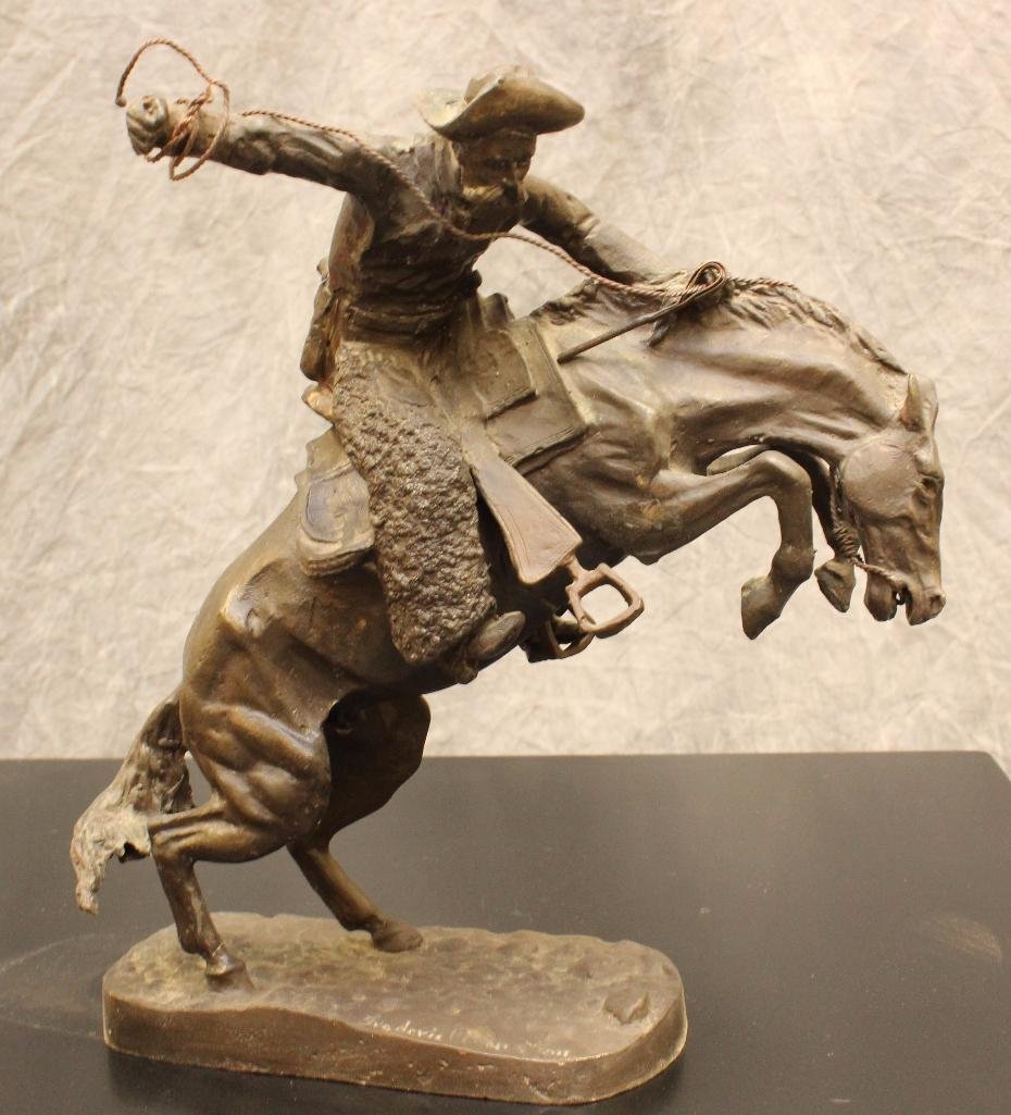 In the Manner of Frederic Remington: Bronze sculpture, "Bronco Buster" signed "Frederic Remington" 12"h x 7"w x 3"d.