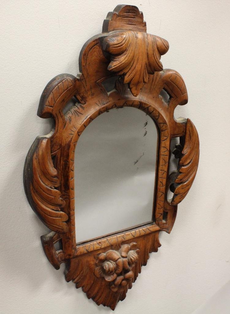 Oak Carved Mirror: Acanthus and rosette carved with a scripted pattern carved edge, 22"h x 13.5"w.