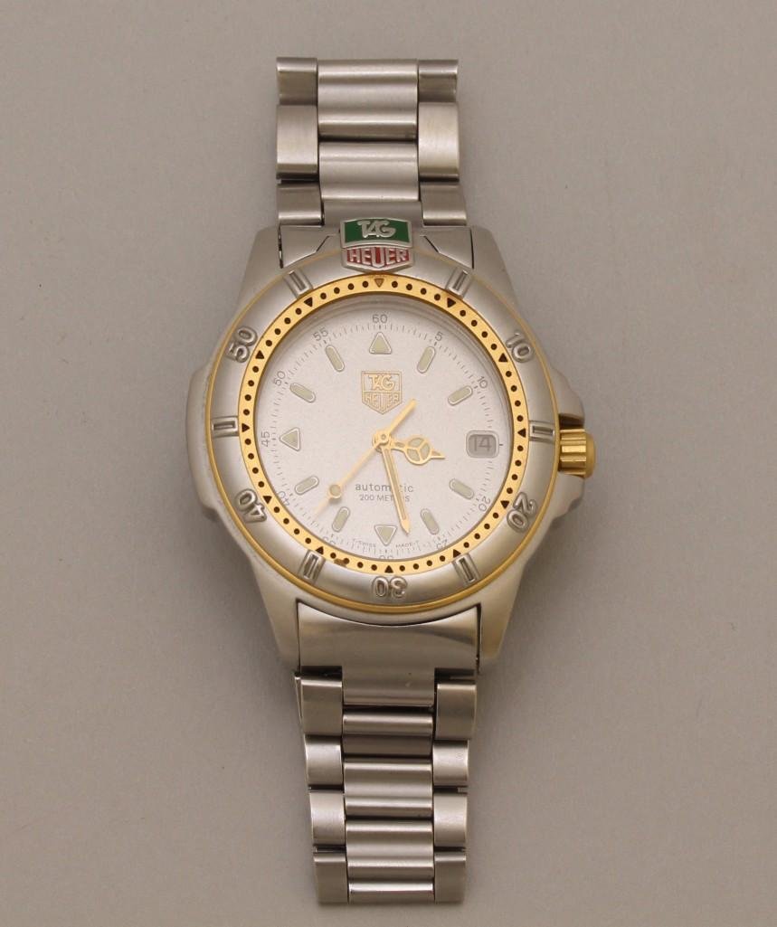 Tag Heuer Wrist Watch: 50.5mm lug end to lug end. Automatic. Water Resistant 200 Meters. Sapphire Crystal. Luminescent hour markers and gold hands. Se