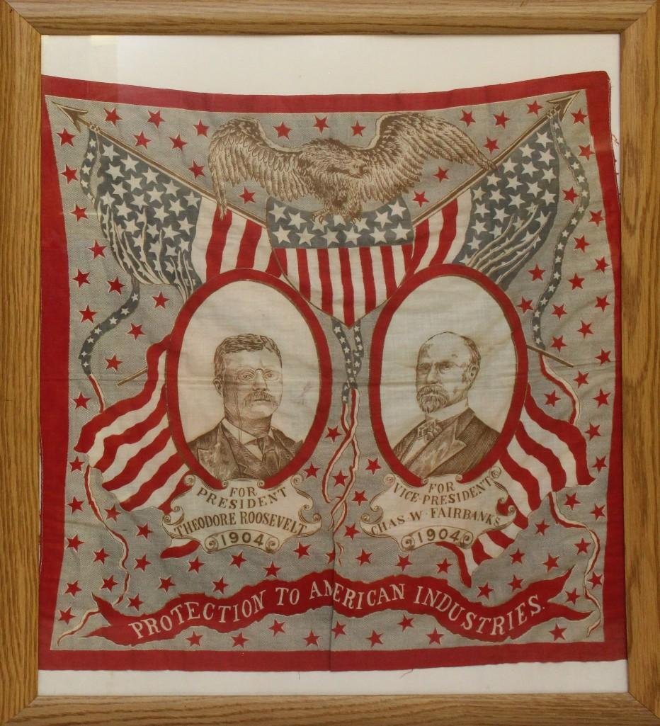 Presidential Campaign Bandana - 1904 - Teddy Roosevelt.: Cotton campaign bandana for the 1904 Presidential election featuring patriotic graphics with banner on lower portion of bandana reading "PROTECTION TO AMERICAN INDUSTRIES". Central portion o