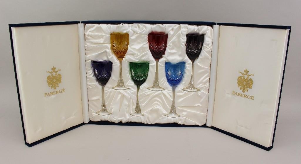 Faberge "Odessa" Flock Wine Glass Set: Set of 6 cut to clear wine glasses in various jeweled colors. Marked "Faberge" on base. Blue velvet, satin lined storage case, includes authentication paperwork. each 8.5"high