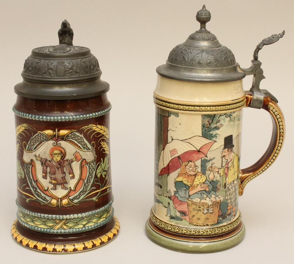 Pair of Mettlach and Sarreguemines Steins: Group of Mettlach, half liter steins with polychrome glaze. Light colored stein with scene 2140 of Tavern Barometer, marked "Mettlach" on underside. Dark brown glazed stein feature image #1823 of whea