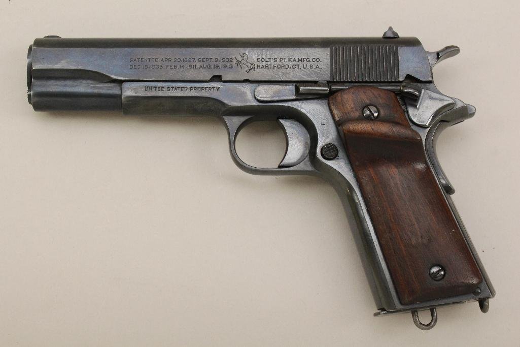Colt Model 1911 US Army semi-automatic pistol.: Cal. 45 ACP. 5" bbl. SN 387905. 99% reblued finish on metal, loss of finish to back strap of frame, good bore, mismatched grips, frame and magazine both have lanyard rings. With 1 - 7 round magazine a