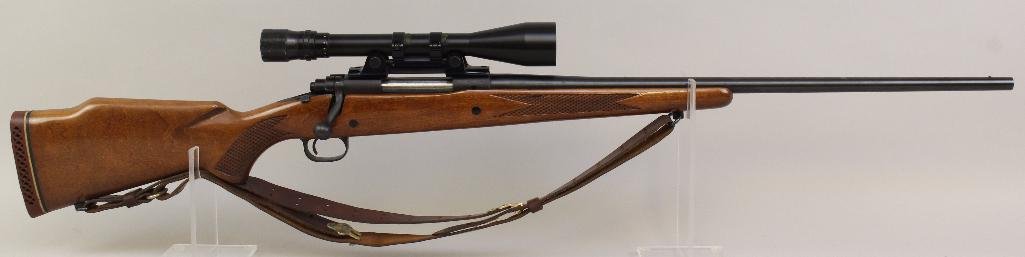 Winchester Model 670 bolt action rifle.: Cal. 300 Win. Mag. 24" bbl. SN 106819. 95% blued finish on metal with some spots of oxidation on barrel, very good bore, checkered walnut stock shows light handling marks and some finish loss and leat