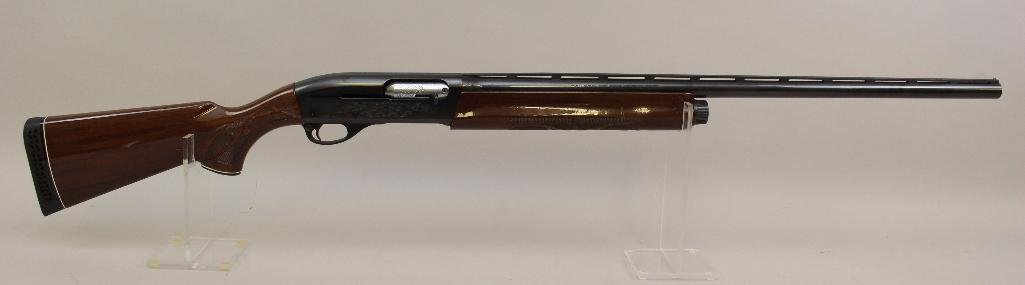 Remington Model 1100 Magnum semi-automatic shotgun.: 12 ga. 28" vent rib. 3" Mag chamber. Mod choke. SN N911761M. 85% blued finish on metal with two areas of oxidation with minor pitting on receiver, good bore, high gloss wood stock shows handling marks