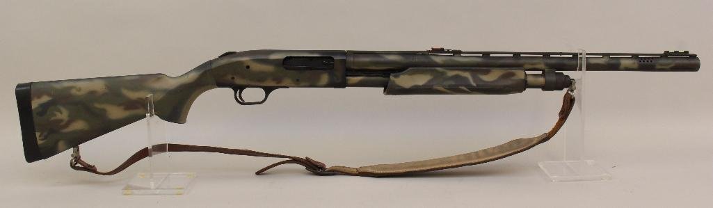 Mossberg Model 835 Ulti-Mag pump action shotgun.: 12 ga. 24" vent rib & ported bbl. 2 3/4", 3" & 3 1/2" chamber. Screw in choke tube. SN UM753505. 100% camouflage finish over entire gun, and synthetic stock, fiber optic sight, very good bore,