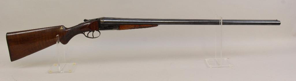 Janssen Fils & Company side by side double barrel: 12 ga. 30" bbls. 2 3/4" chambers. IM/Full chokes. SN 89360. 85% blued finish on barrels, underside of barrels shows very light patina in spots and light pitting, 85% case colored receiver appears to s