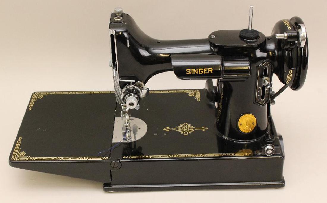Singer Featherweight Sewing Machine: S/N: AH652484, with foot pedal, attachment set and case, 9.5"h x 15"d.