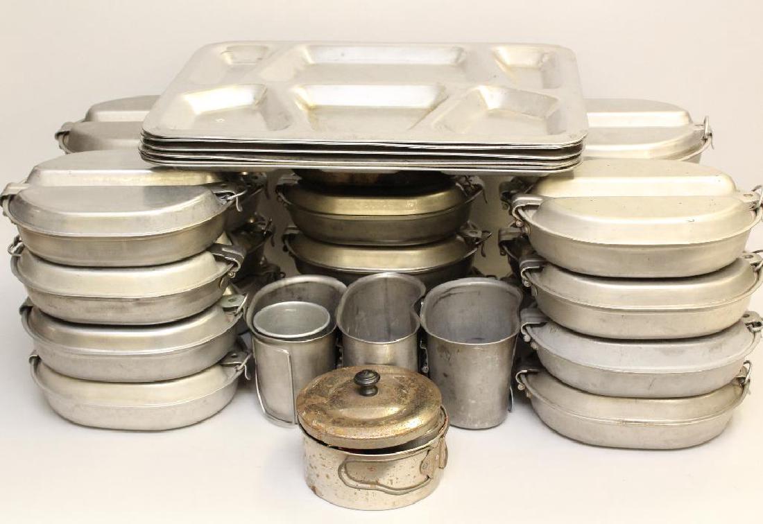 Post WWII Military Mess Equipment: Grouping of post World War II United States military mess equipment including; 1.) 6-metal six compartment mess trays that measure 15.5" x 12", 2.) 20-mess tins with no utensils, 3.) 3-canteen cups, 4