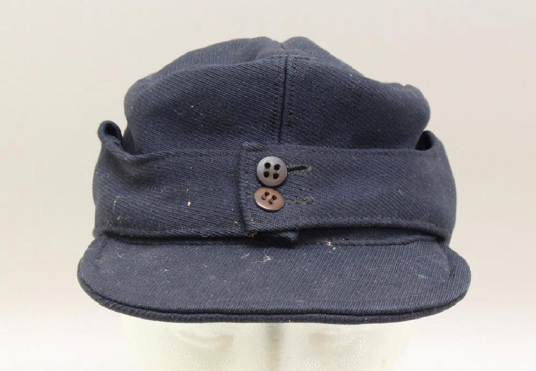 German M43 Hat: German M43 style WWII period hat. Hat is blue in color and exhibits soiling and some light mothing.
