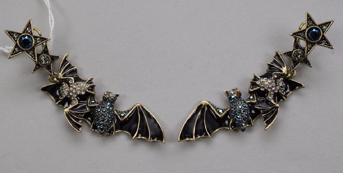 EARRINGS. HEIDI DAUS. BATS HANGING FROM STARS: CRYSTAL AND ENAMEL. OMEGA BACK POST. 3 1/2" LONG DANGLES.