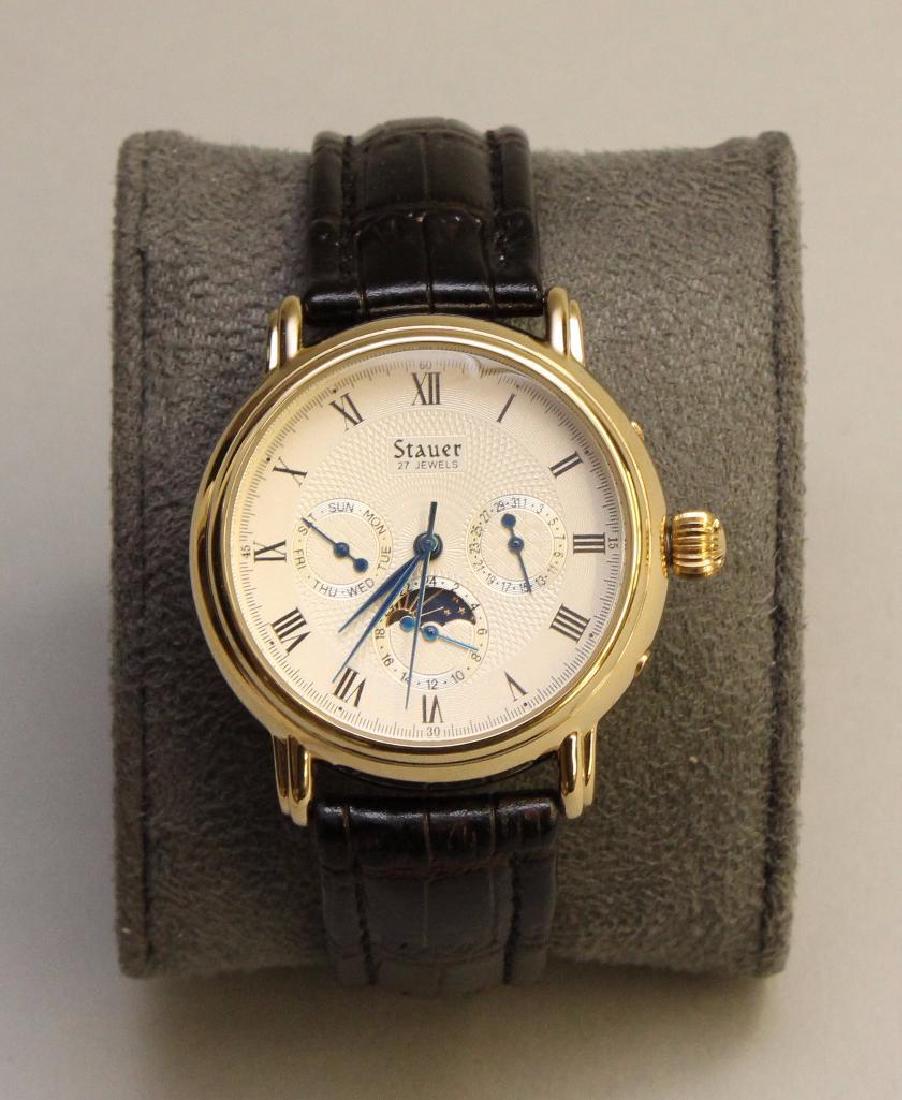 WRIST WATCH. STAUER: 40MM DIAMETER. 27 JEWELS. TRIPLE REGISTER. EXHIBITION BACK.
