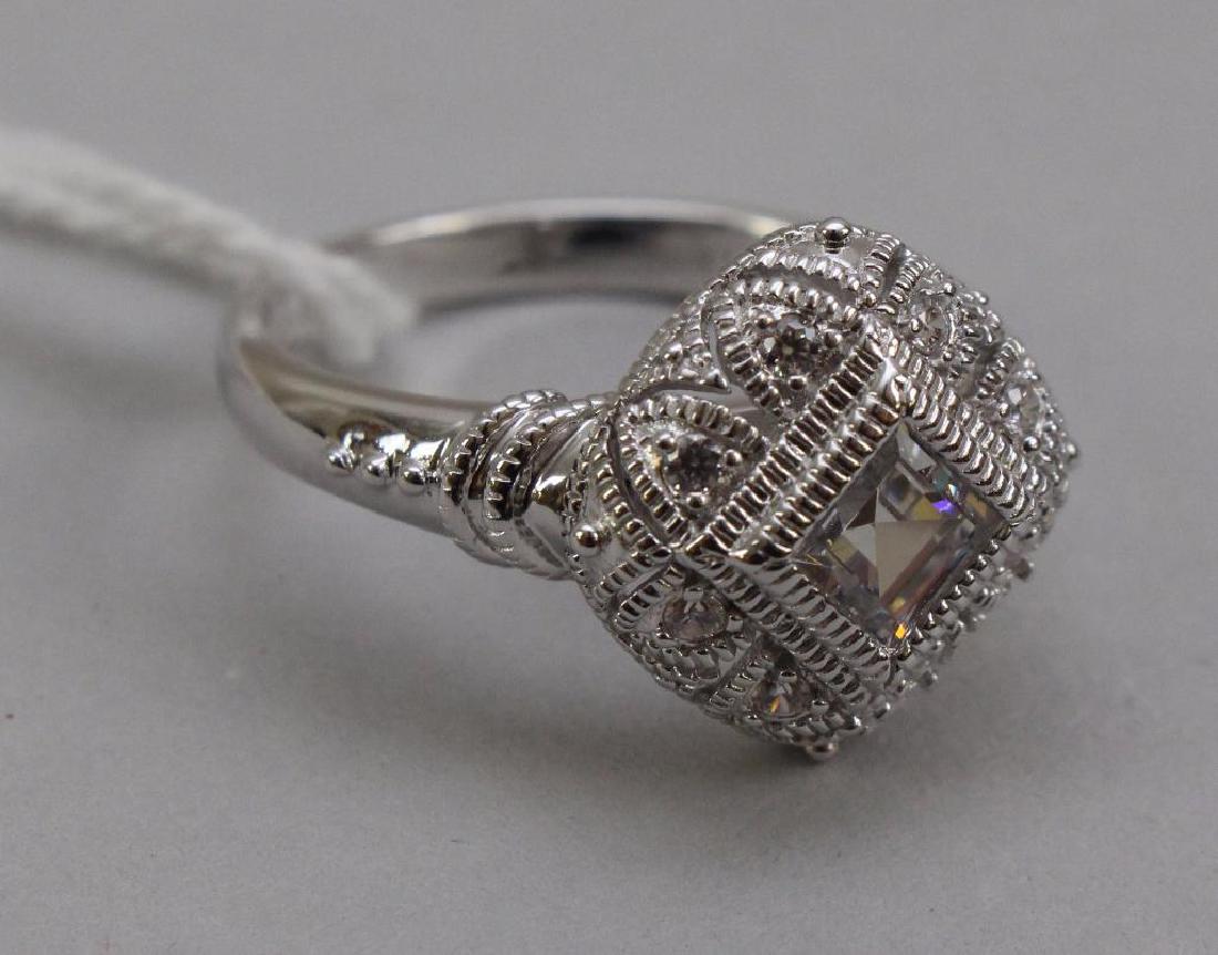 STERLING RING. XAVIER. CZ: 5MM PRINCESS CUT CENTER WITH ROUND ACCENTS. SIZE 8.