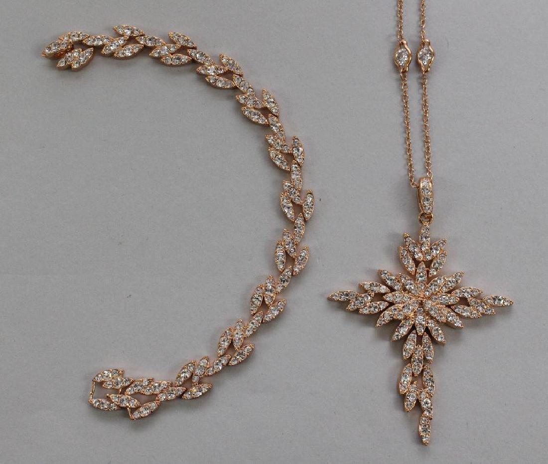 PENDANT ON CHAIN, BRACELET. ADRIENNE. PJM. CROSS.: ROUND DIAMONITE. ROSE-TONE