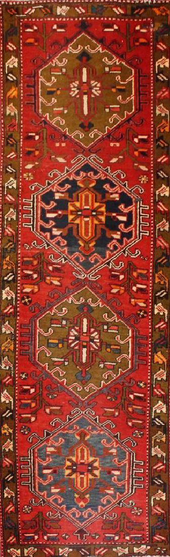 Persian Hall Runner: Four hexagonal crab medallions in a red field with a repeating patterned brown border, 9'2"l x 2'10"d.