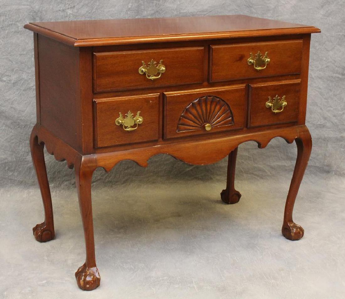 Chippendale Style Lowboy: Mahogany with two drawers over three drawers including a shell carved center drawer, shaped apron on ball and claw feet, 33"h x 37"w x 20"d. Nick marks around the feet.