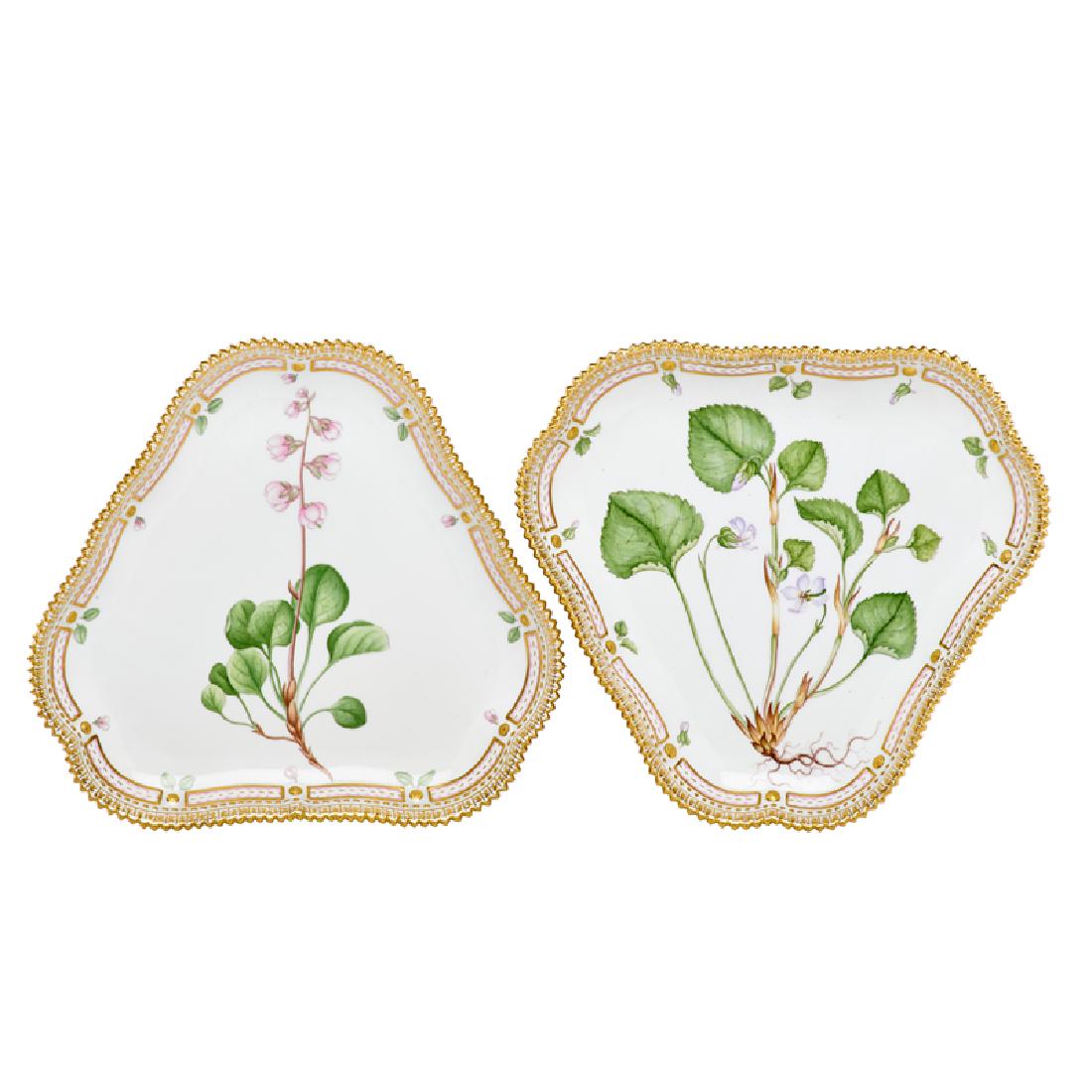 ROYAL COPENHAGEN FLORA DANICA PORCELAIN PLATES: Two triangular plates, one Viola mirabilis L. and one Pyrola grandiflora Rad., Denmark, 20th c. Marked 8 1/4" x 9"