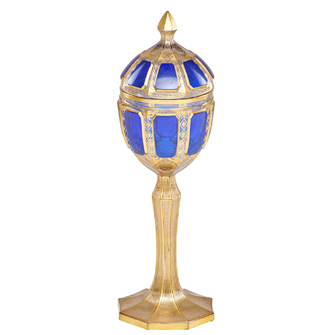 BOHEMIAN GLASS POKAL: Clear glass with intricate gilt enamel spiral decoration and raised cobalt panels with conforming lid, Continental, late 19th c. 14" x 4 1/4" dia.