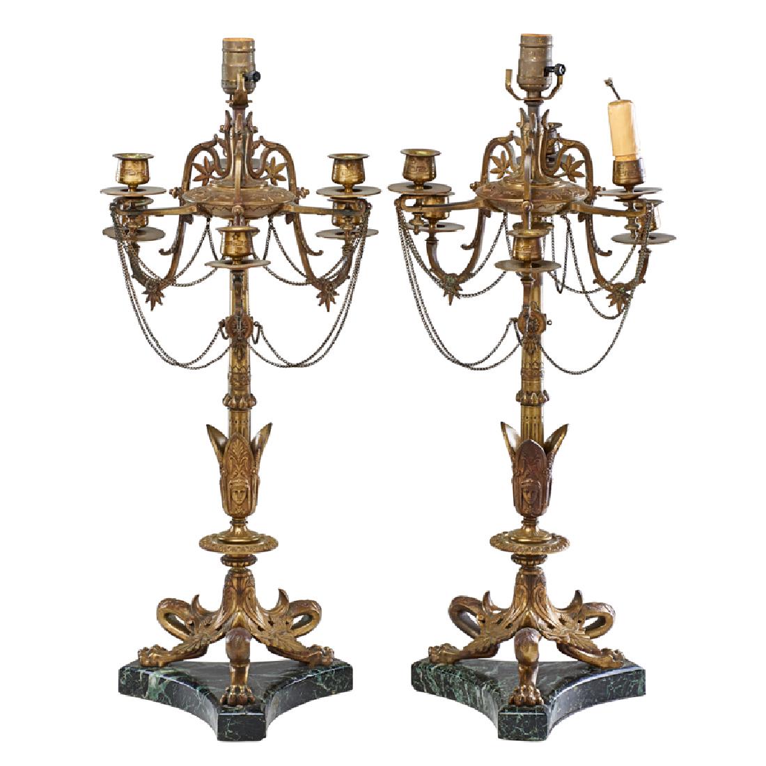 PAIR OF FRENCH EMPIRE STYLE CANDELABRA TABLE LAMPS: Bronze lamps with six candle arms on a finely detailed shaft and three animalier legs, mounted on marble plinths, France 27" x 12 1/2"