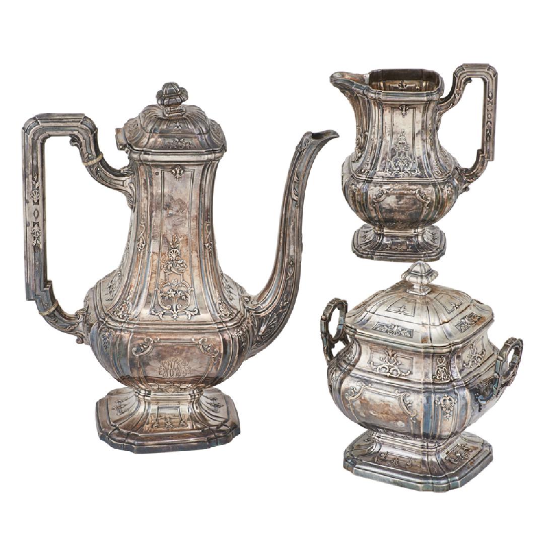 THEODORE B. STARR FRENCH SILVER MOCHA SERVICE: Three: Coffee pot, covered sugar, and creamer with shell and foliate design, monogrammed on side, inscribed on underside "June 18th 1914", France, early 20th c. Marked Tea pot: 9 1/2" x 7 3/4" 39.9 OT