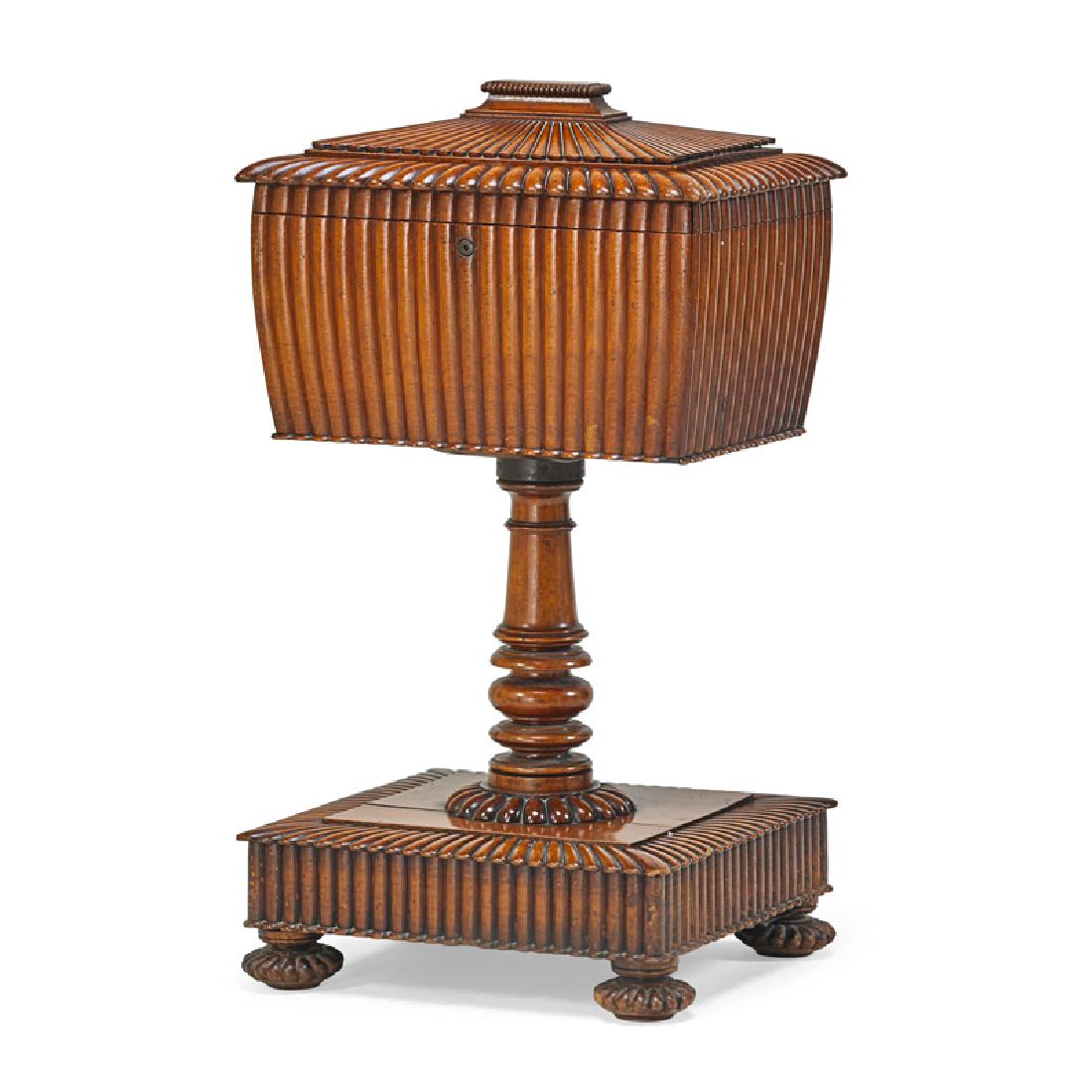 ANGLO-INDIAN HARDWOOD FITTED CELLARETTE: Fluted carvings on pedestal base with twelve glass decanters, lock stamped JT Needs and J Bramah, Colonial, late 19th c. 38" x 21 1/4" x 15 1/2" Provenance: Collection of Alan Olswing and Douglas Crow