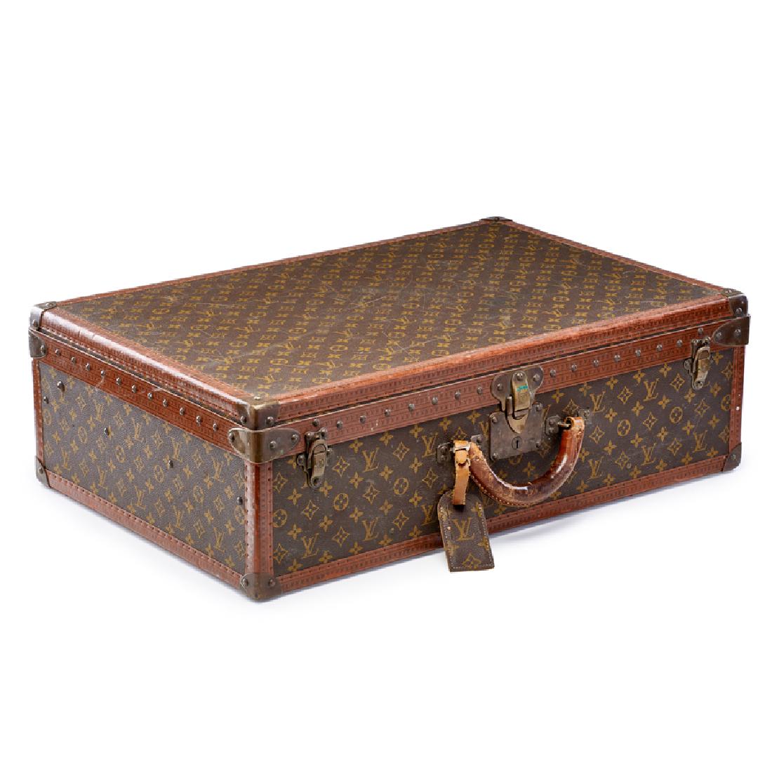 LOUIS VUITTON "MONOGRAM CANVAS" SUITCASE: An Alzer 70 hard-sided suitcase with removable interior tray, France, 20th c. Marked 18 1/2" x 27 3/4" x 8 3/4" Provenance: Collection of Alan Olswing and Douglas Crowell