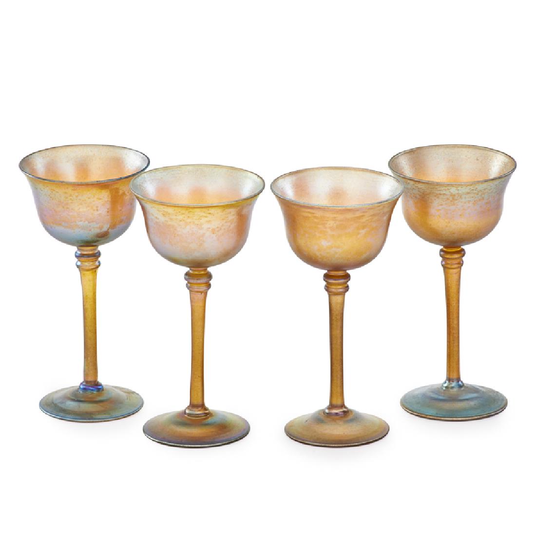 TIFFANY STUDIOS FAVRILE WINE GLASSES: Four: Gold favrile with slightly flared rims, New York, early 20th c. Signed 6" x 3" dia. Provenance: From a private New Jersey collection