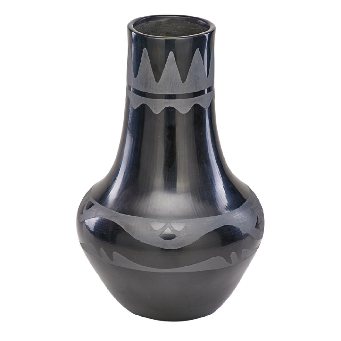 MARIA MARTINEZ (American, 1887-1980): Gourd form polished San Ildefonso blackware vase with matte water serpent design across body, USA, early 20th c. Signed 14" x 8 1/2" dia.