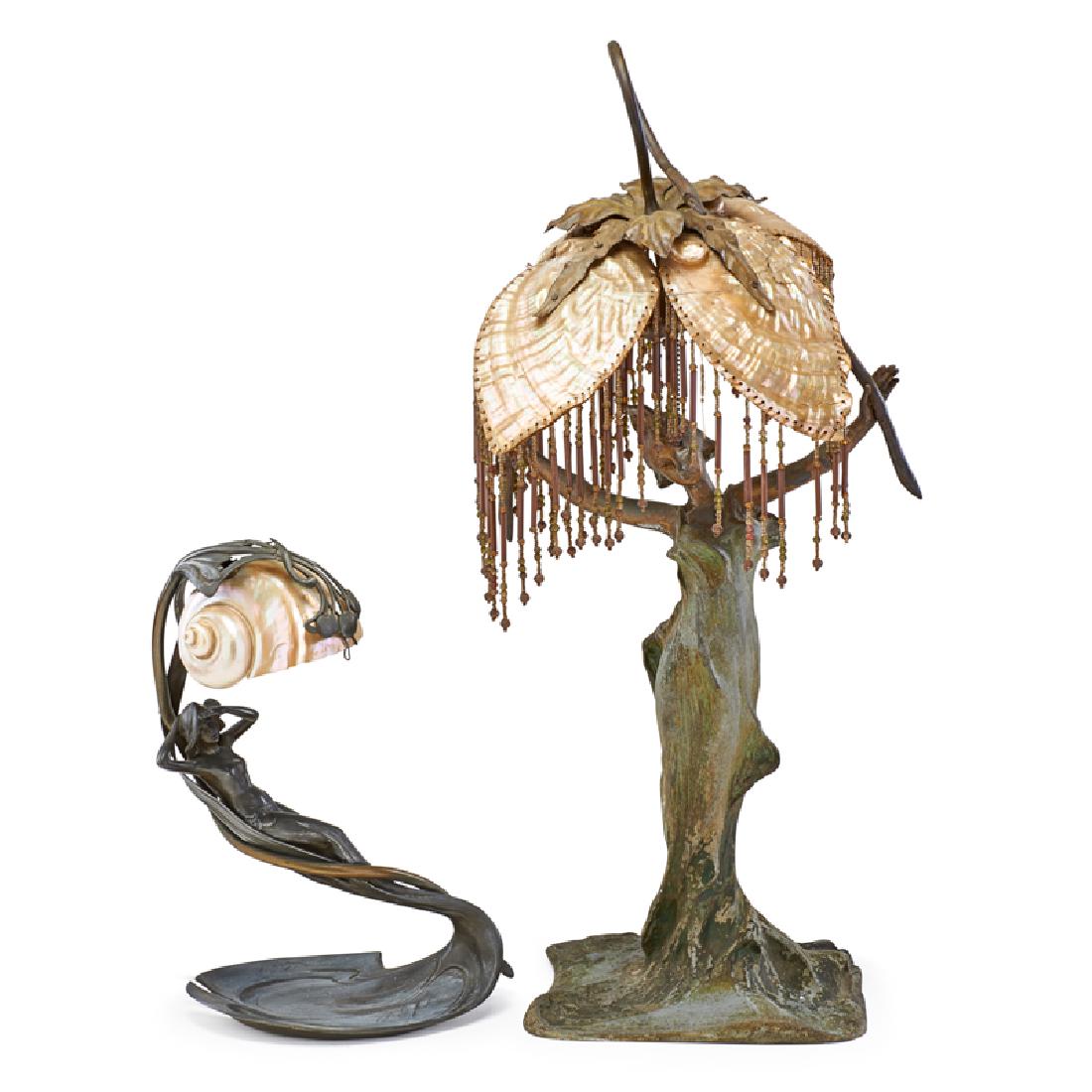 STYLE OF C. BONNEFOND, ETC.: Two Art Nouveau figural female table lamps: Bonnefond reproduction with reclining nude under conch shade, and draped dancer under figural shell shade with beaded tassels, France, late 19th/early 20th 