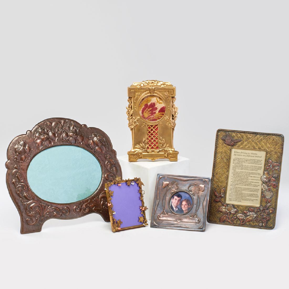PICTURE FRAMES: Five brass and copper easel frames in various styles: Renaissance Revival, two Art Nouveau, Russian with flowering vines and bees with beads, and basket weave pattern overlaid with bird and flowers ;