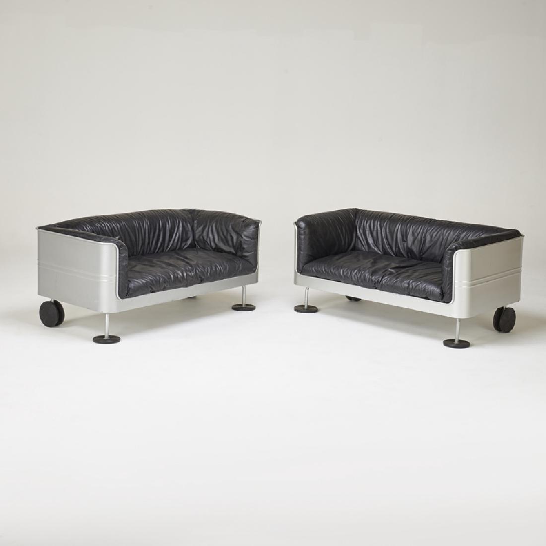 ESSE: Pair of Traffic settees, Venice, ca. 1990s; Leather, aluminum, enameled metal; Upholstery label to one; 26" x 56" x 30"