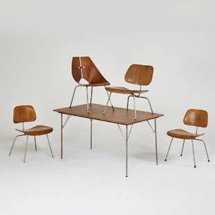 CHARLES AND RAY EAMES; RAY KOMAI: DTM-1 dining table and three DCMs, together with Komai side chair, USA, c.1950s/60s; Chromed steel, walnut veneered plywood, laminate tabletop; Remnants of labels; Table: 28 1/2" x 54" x 34", DCMs: 30