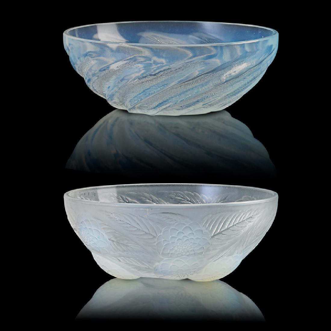 LALIQUE Two bowls, "Poissons No. 1" and "Dahlias": LALIQUE Two bowls, France, des. 1921: "Poissons No. 1" and "Dahlias" M p. 749, nos. 3210/11 Opalescent glass Both molded R. LALIQUE FRANCE Dahlias: 3 3/4" x 9 1/4", Poissons: 3 3/8" x 9 1/4" Provenanc