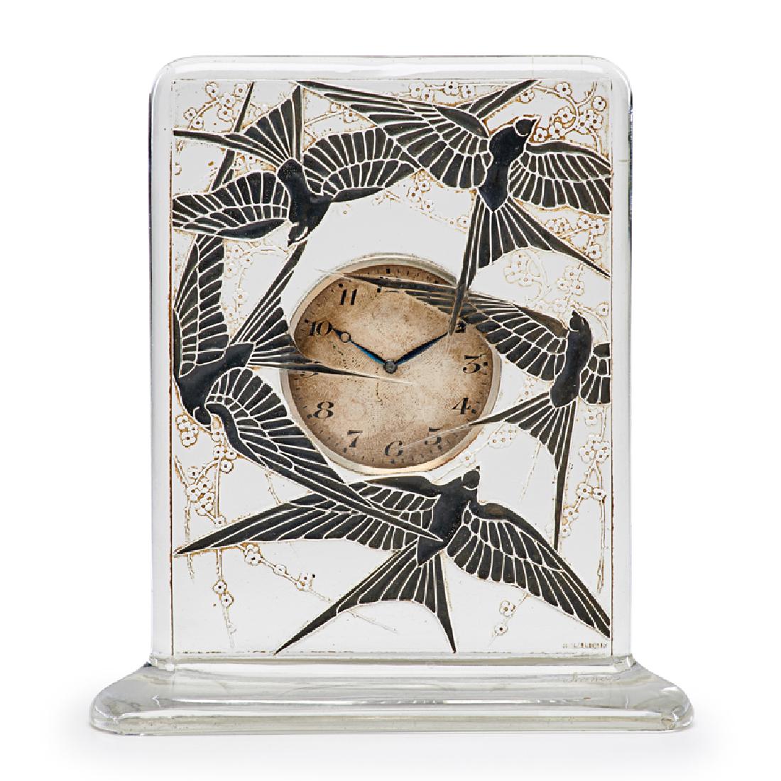 LALIQUE "Cinq Hirondelles" clock: LALIQUE "Cinq Hirondelles" clock, clear glass with black enamel, France, des. 1920 M p. 376 no. 761 Molded R. LALIQUE, etched France, clockworks with Henri Ditisheim marks 6" x 5 1/4" x 2"