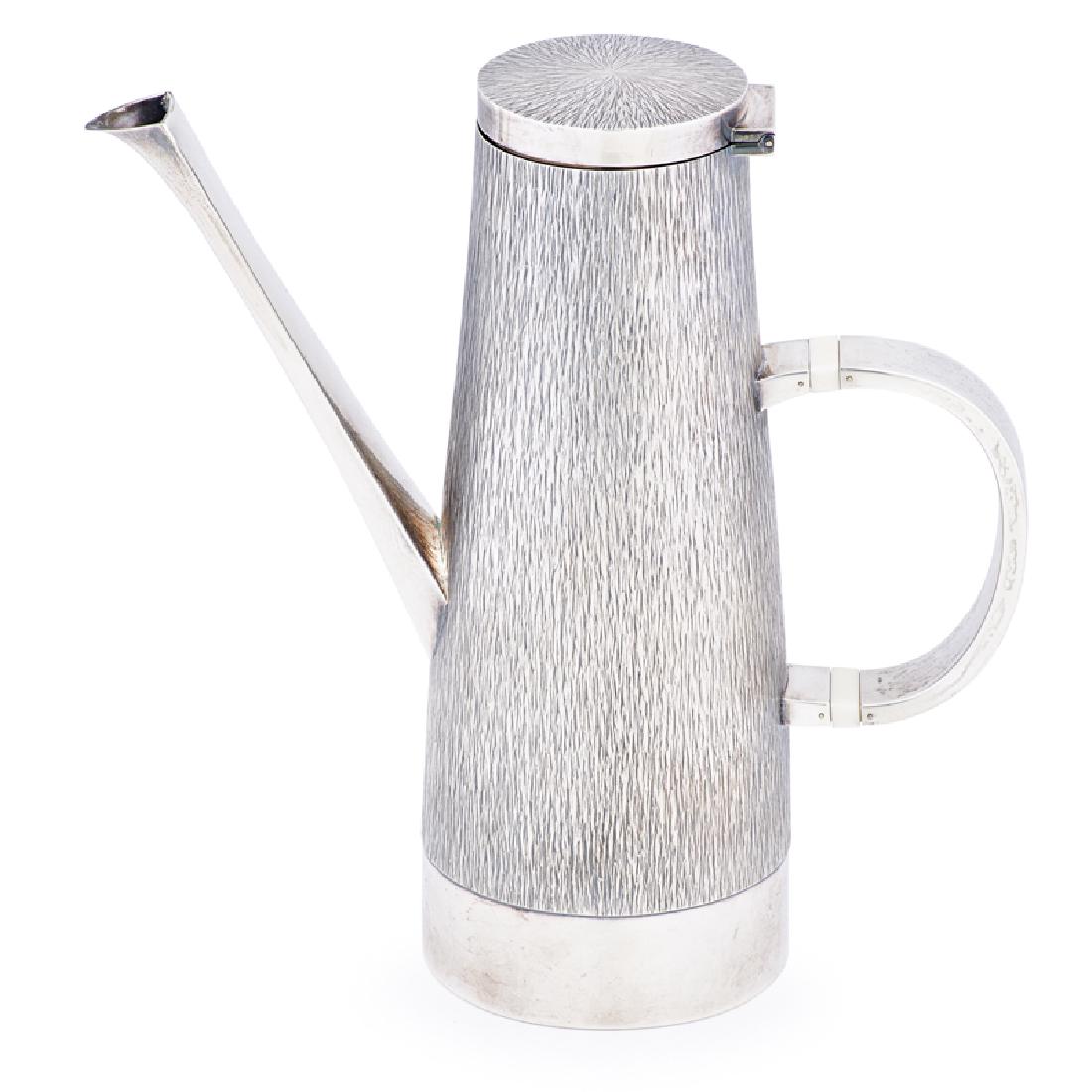 GERALD BENNEY Sterling silver coffee pot: GERALD BENNEY (1930 - 2008) Coffee pot with woodgrain pattern, England, 1965 Sterling silver, celluloid Stamped maker's, standard, city, and date marks 9 1/2" x 9" 29.8 OT